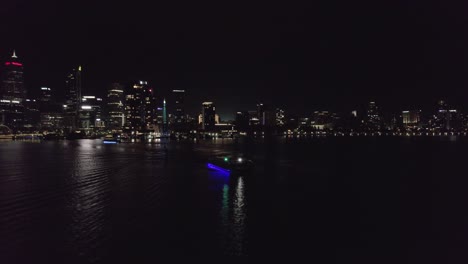 perth city drone view at night with river boat
