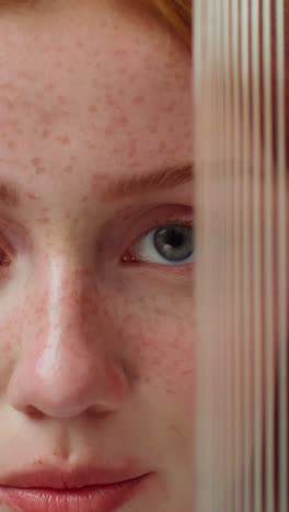 close-up portrait of a woman with freckles