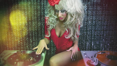 female drag artist dancing and djing