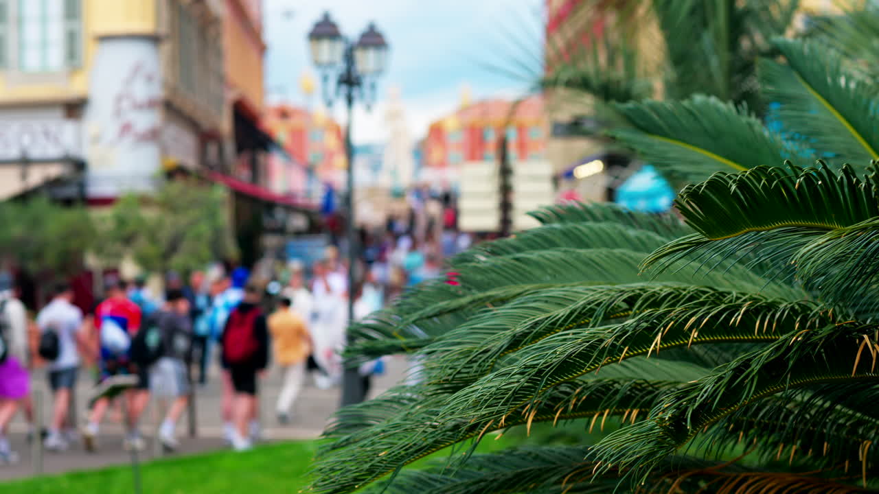 Nice, France - May 12, 2025: People walking through the Massena Square in daylight