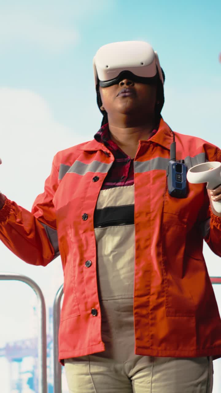 Vertical video Woman on offshore platform deck using virtual reality tech to configure systems