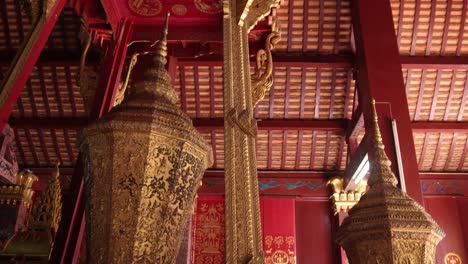 red ceiling interior of buddhist temple in luang prabang, laos traveling southeast asia