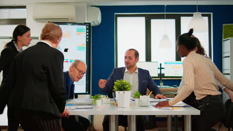 man company leader waiting diverse team for business conference