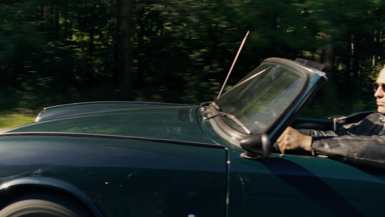 Driving a Convertible Through the Forest