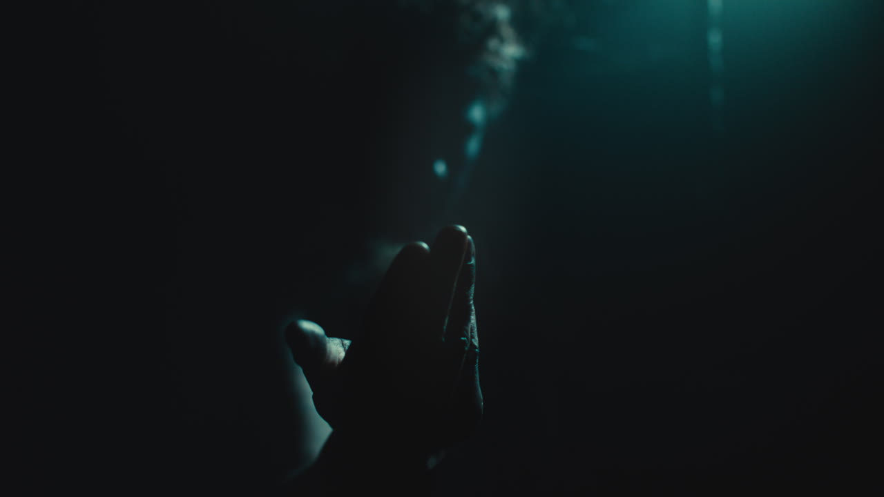 The witch makes a beckoning gesture with her hand