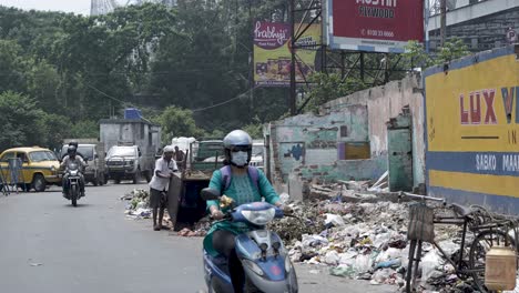 street scene with garbage and people
