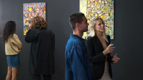 couple admiring modern art in an art gallery