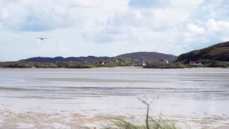 Shot-of-a-passenger-plane-approaching-and-landing-on-the-beach-at-Barra-airport