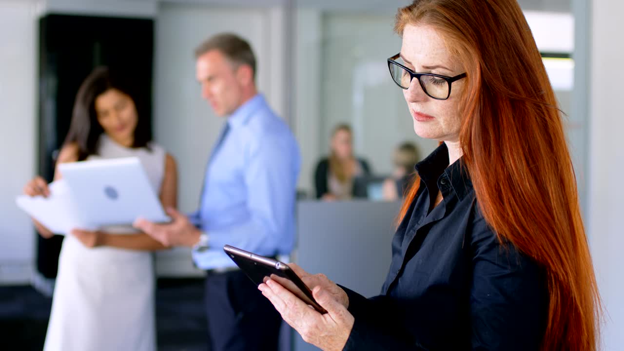 Female executive using digital tablet 4k