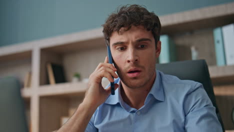 stressed boss arguing cellphone conversation closeup. dissatisfied man talking