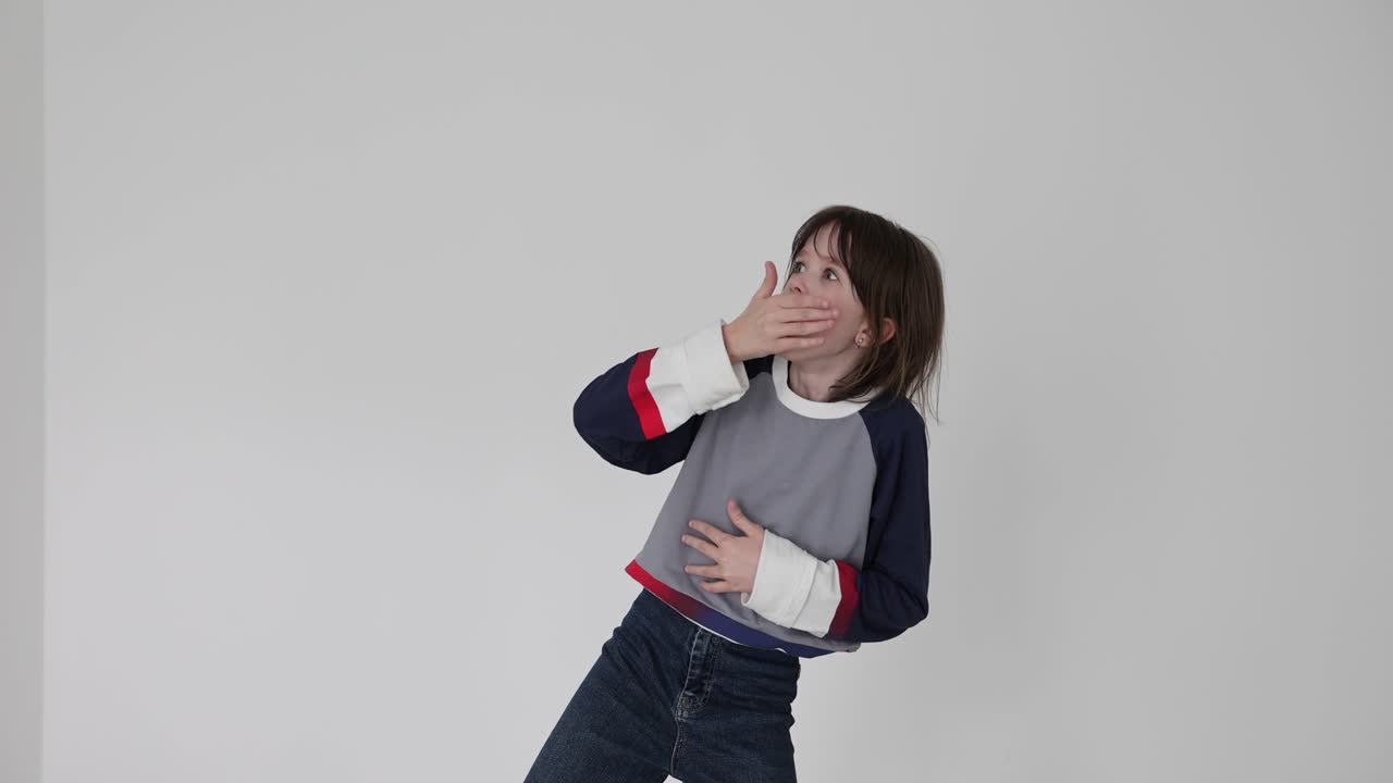 A girl poses in a studio setting