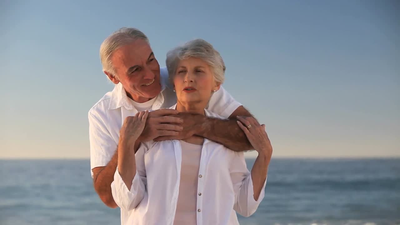 Aged man hugging his wife