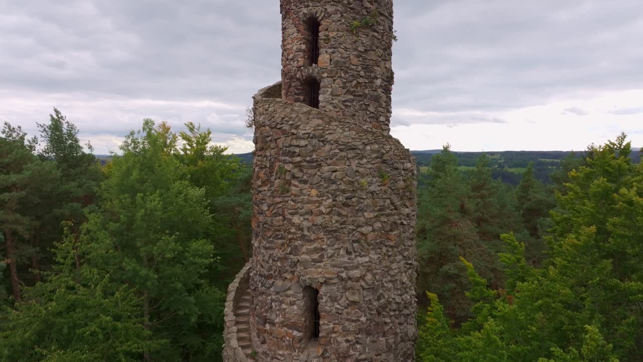 Scenic aerial view of Krasno's spiral tower and lush forest, Czech Republic