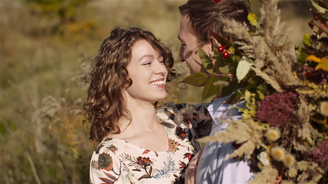 Hugging couple glowing with happiness