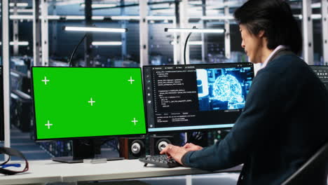 data center programmer using green screen pc monitor, using ai