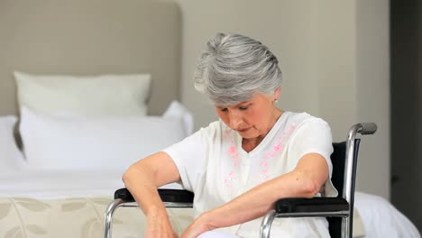 woman in wheelchair waking up and smiling