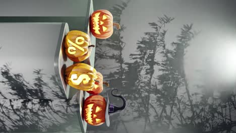 halloween-themed display with carved pumpkins on platforms, one with a witch hat and others with percentage and dollar signs, shadows of branches on a black background