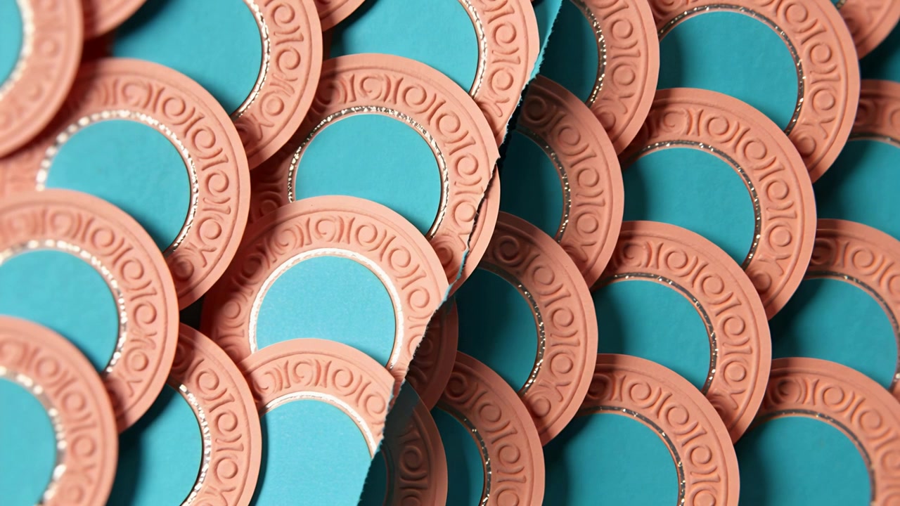 Shifting right column moving discs on tabletop, realigning pattern, showing teal, terracotta, metal