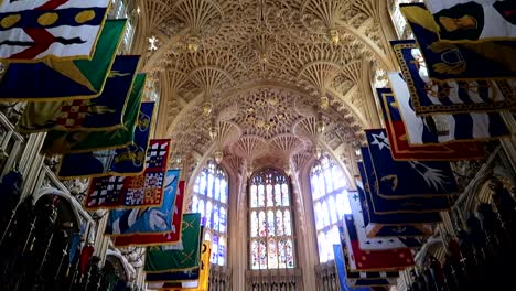 Tilt-down-inside-Westminster-Abbey-with-several-flags-hanging-under-the-roof