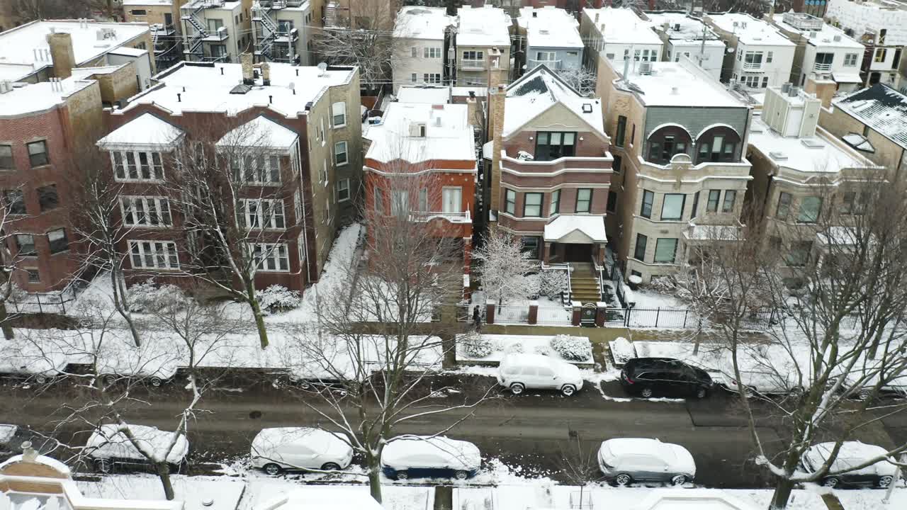 Aerial, Couple Walking on Sidewalk in Upper Middle Class City Neighborhood during Winter (Establishing Shot)
