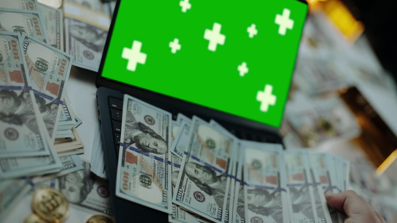 Money and Laptop with Green Screen