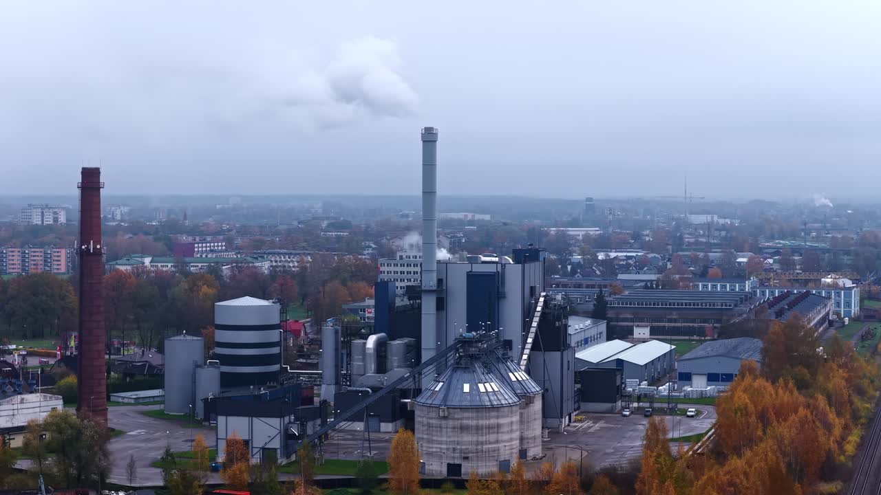 Fossil fuel burning power station in cloudy day. Aerial view