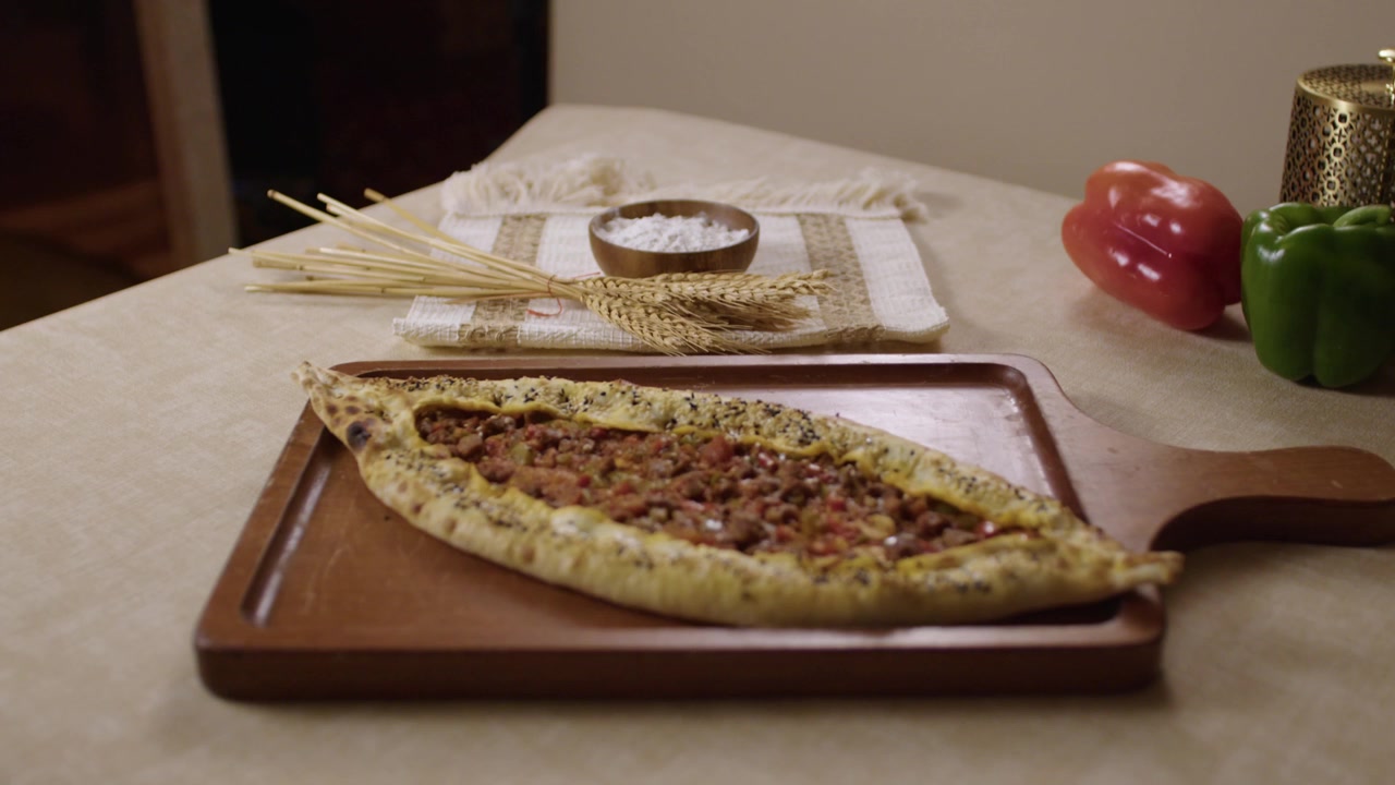 Delicious Turkish pide, a traditional boat-shaped flatbread with minced meat filling