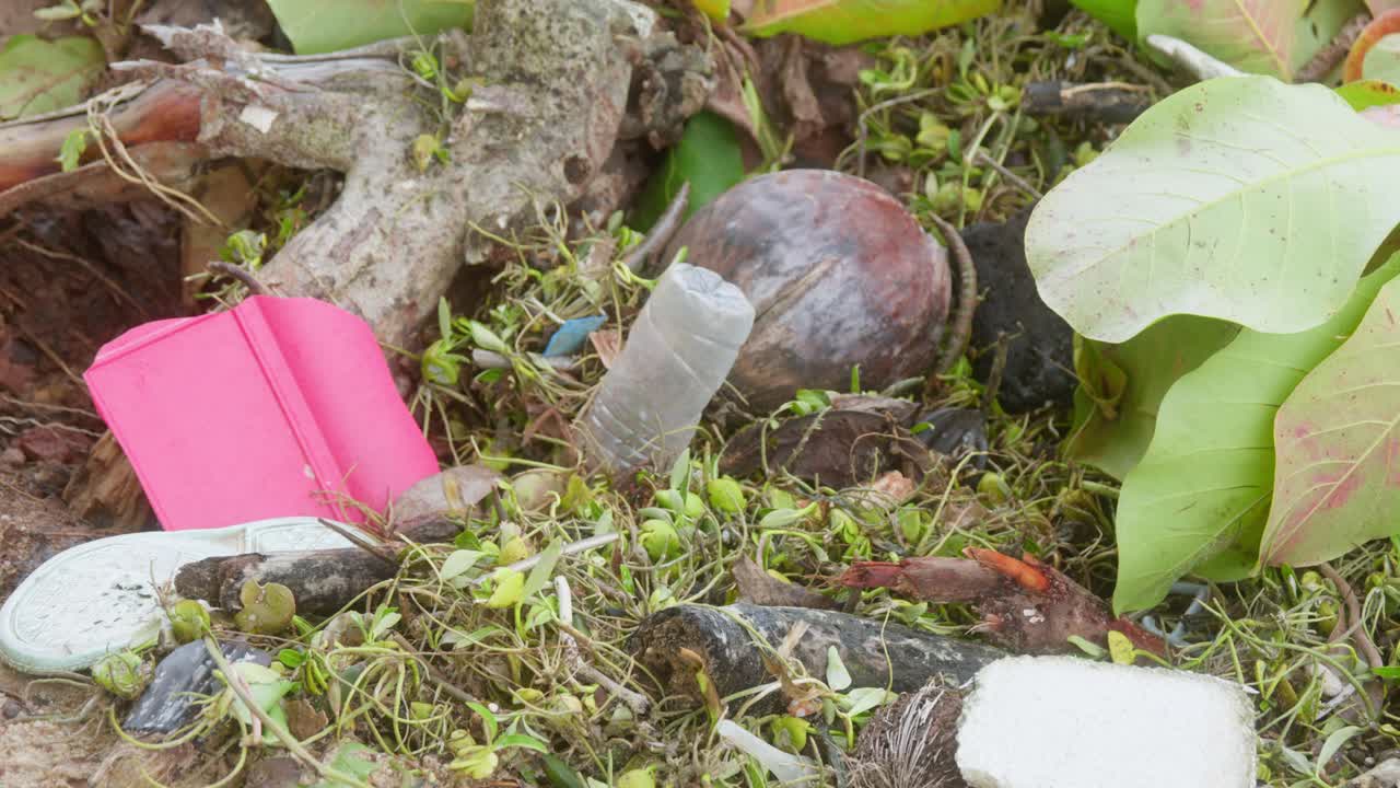 Aftermath of cyclone weather monsoon conditions in remote Cape York. Rubbish and debris washed up on the coastline. Clip 8