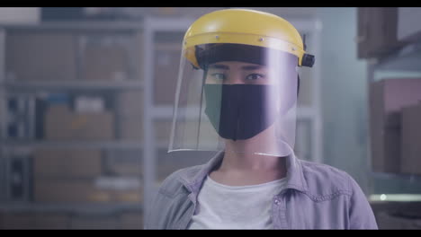 person wearing safety gear in warehouse