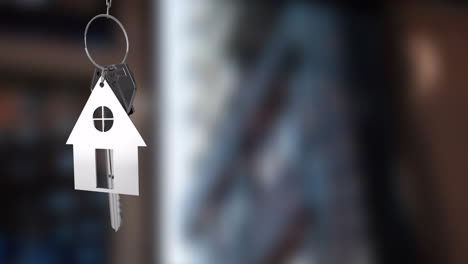 house-shaped keychain animation over blurred background