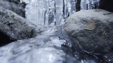 wide shot of a small frozen waterfall