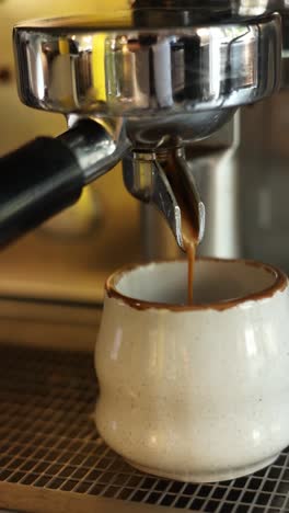 espresso pouring into a cup