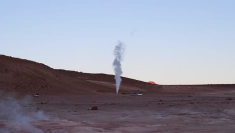 cone geyser spews hot gas, steam on arid altiplano desert in bolivia