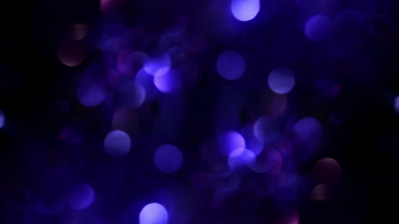 Sfondo astratto con luci bokeh blu e viola scintillanti