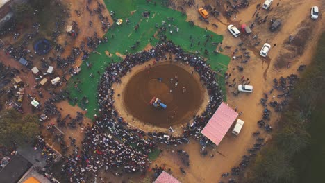 top-down-Aerial-drone-shot-of-a-arena-or-akhada-for-kushti-or-wrestling-in-an-indian-village