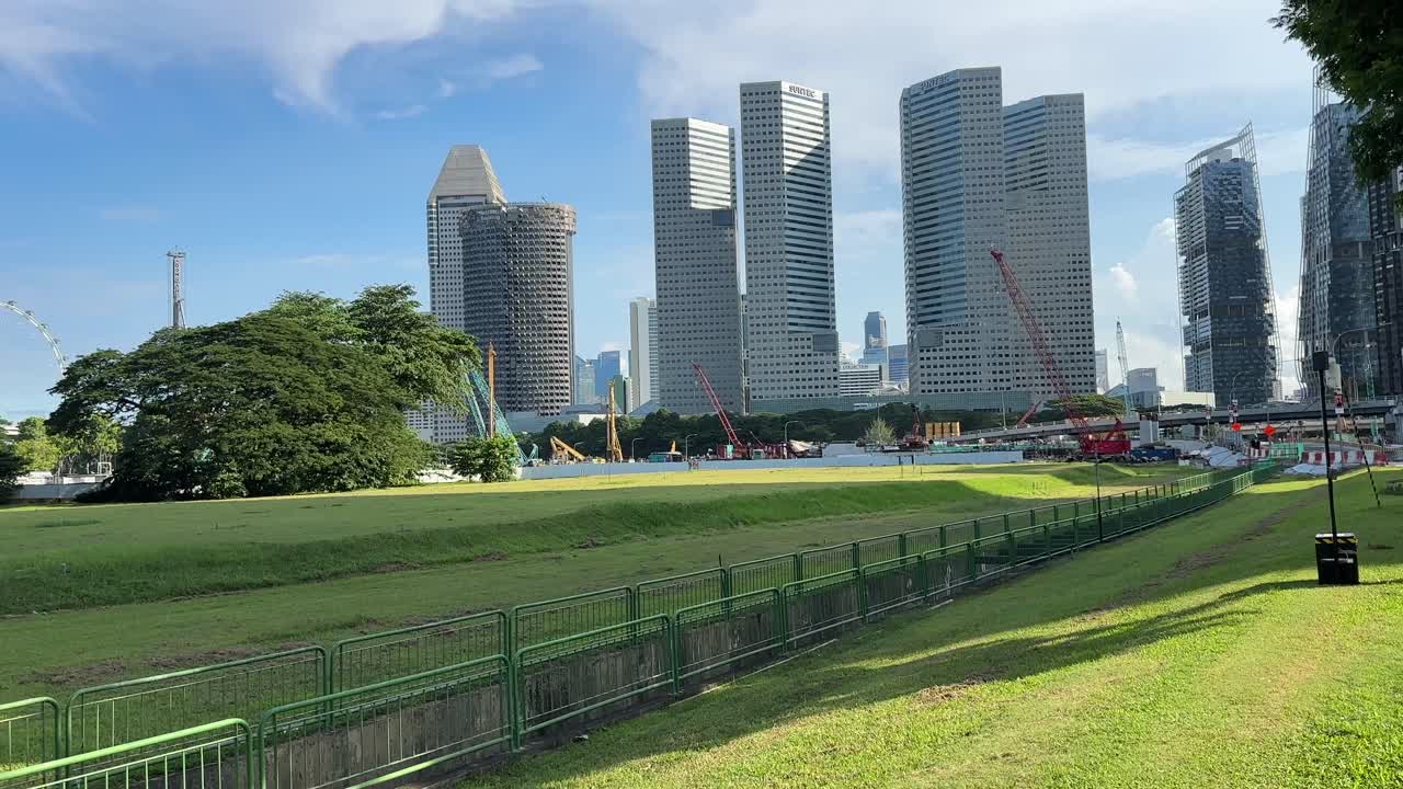 Pan up reveal of skyscrapers tall buildings skyline singapore