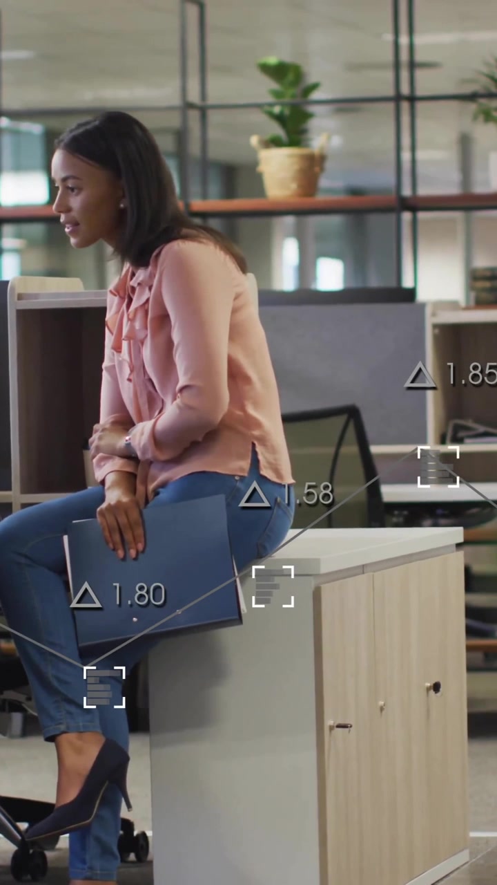 Animation of financial data processing over diverse business people in office
