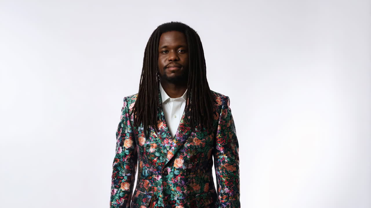 Portrait of a Man with Dreadlocks Wearing a Floral Blazer