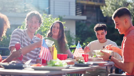 friends celebrating independence day with outdoor barbecue