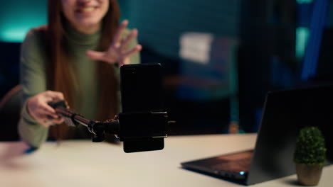 close up of mobile phone used by teenage entertainer doing video