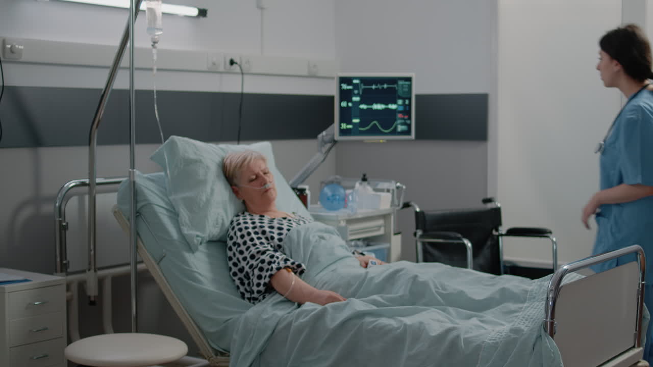 Medical assistant visiting retired patient sleeping