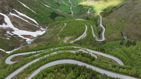 extremely curvy and winding roads at strynevegen in hjelledalen norway - aerial looking down at curves and dramatic landscape