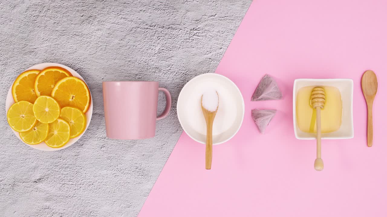 Pink utensil and supplies for making tea appear from top and bottom. Stop motionPink utensil and supplies for making tea appear from top and bottom. Stop motion