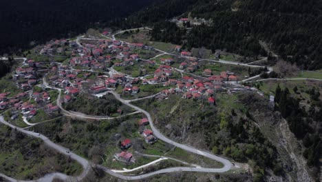 Flying-over-a-scenic-village-with-narrow-roads-in-the-Greek-mountains-|-4K