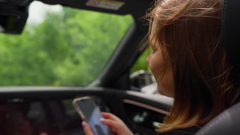 Woman using phone while driving