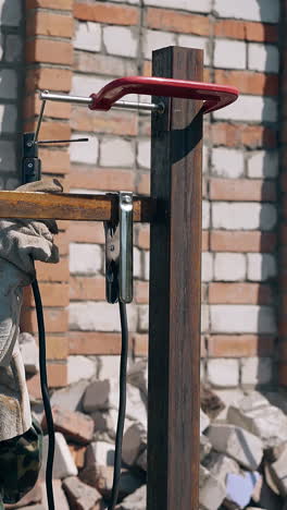 welding a metal fence post