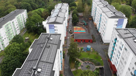 Colorful-apartment-buildings-with-solar-panels-on-top-in-Sweden,-aerial-view