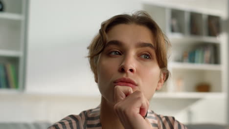 Pensive-millennial-girl-looking-webcam-closeup.-Thinking-woman-watching-webinar