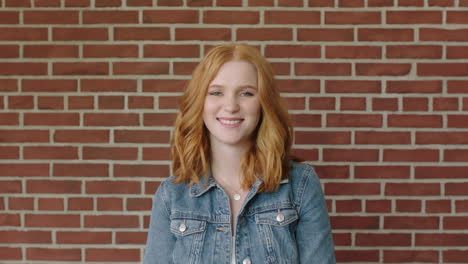 portrait of beautiful red head woman smiling cheerful feeling optimistic student indoors