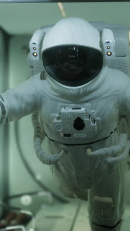 astronaut in space suit during spacewalk